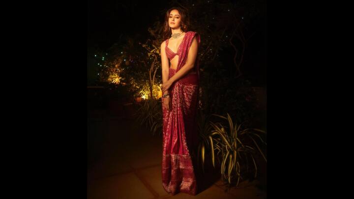6. Ananya Panday: Ananya's vibrant saree adorned with intricate motifs gives a dazzling look. Her choice of a plunging neckline blouse and delicate jewellery adds a youthful, modern flair, making this ideal for any wedding function. (Image Source: Instagram/@ananyapanday)