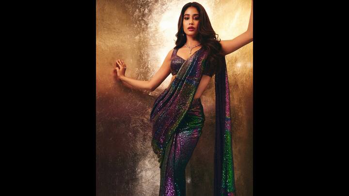 5. Janhvi Kapoor: Janhvi looked modern and elegant in a stunning iridescent saree and a bold blouse. The shimmering hues and bold fabrics make this an iconic saree that blends luxury with youth. (Image Source: Instagram/@janhvikapoor)