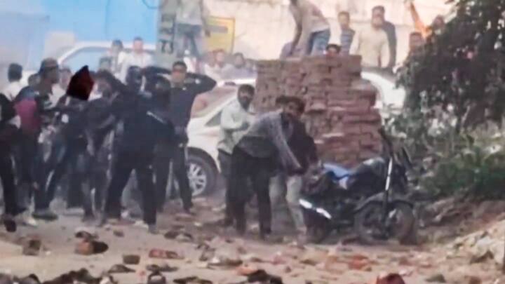 Locals pelt stones at security personnel during a second survey of the Jama Masjid. Four people were killed during the clashes The district administration has already imposed prohibitory orders and barred the entry of outsiders till November 30. (Photo: PTI)