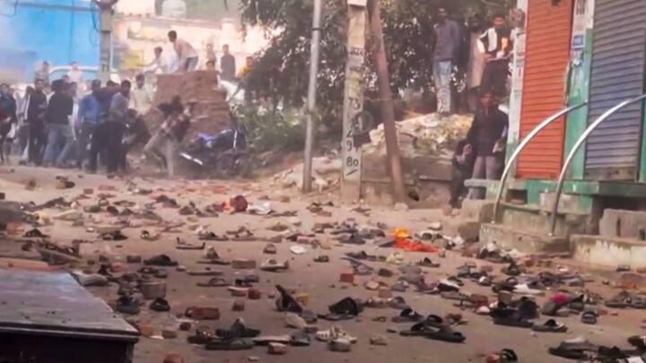 Footwears and brick bats lying on a road after violence erupted during the second survey of the Jama Masjid, claimed to be originally the site of an ancient Hindu temple, in Sambhal. (Photo: PTI)