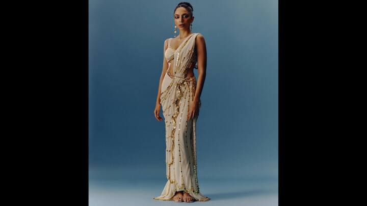 3. Sobhita Dhulipala: Sobhita reinterprets traditional elegance with a dreamy off-white saree with gold embellishments. The gown inspired look adds to the fairytale charm that's perfect for a wedding or evening celebration. (Image Source: Instagram/@sobhitad)