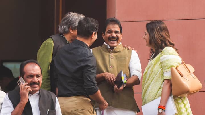 Congress MP KC Venugopal with Shiv Sena MP Priyanka Chaturvedi and others MPs during the first day of the Winter session of Parliament. (Photo: PTI)