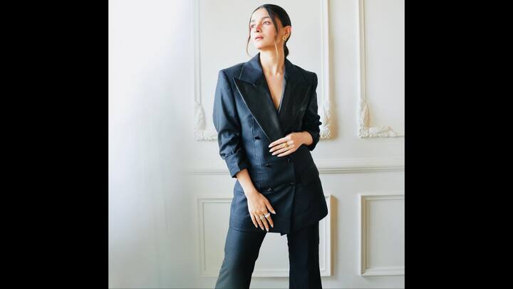 1. Black Pantsuit Set: Alia wore a black tailored pantsuit with structured shouldered details that made her look powerful. The bold silhouettes paired with understated accessories exuded confidence and modern elegance. (Image Source: Instagram/@aliaabhatt)