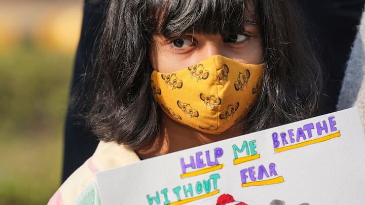 A group of students and their parents held a protest near Parliament, urging political leaders to address the problem of Delhi's deteriorating air quality.