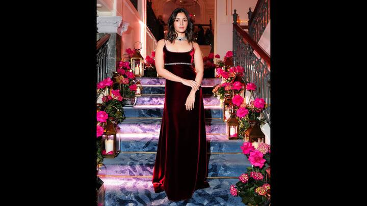 3. Elegant Velvet Gown: A velvet gown is a timeless and versatile choice for winter occasions, seamlessly blending elegance and comfort. The luxurious, plush texture of velvet not only provides warmth but also exudes a regal charm that stands out. Whether adorned with minimal embellishments for a chic, understated look or intricate details like embroidery, sequins, or beadwork for a more opulent style, a velvet gown is a statement piece. Its rich, flowing fabric enhances the silhouette, adding a touch of sophistication and grace. Perfect for formal events, weddings, or festive celebrations, a velvet gown ensures you make a lasting impression with effortless glamour. (Image Source: Instagram/@aliaabhatt)