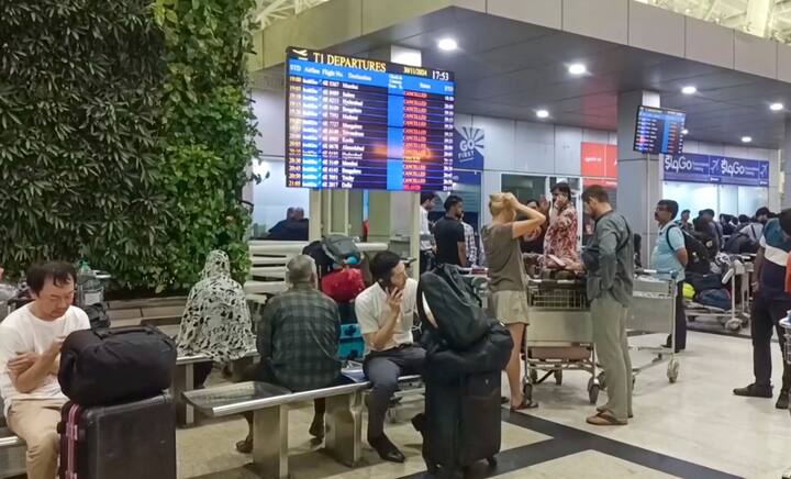 Stranded passengers at the airport, in Chennai, Saturday, Nov. 30, 2024. Chennai airport announced suspension of operations till 4 am on December 1 following heavy inundation of runways and the taxiway, due to the cyclone 'Fengal' triggered rains and the 'adverse weather condition,' with over 50 flights being cancelled and scores of passengers left in the lurch. (Image Source: PTI)