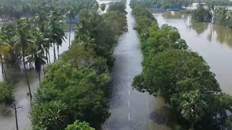 villupuram Road damage due to fengal Rain. crone video released கண்ணுக்கெட்டும் தூரம் வெள்ளம்! தண்ணீரில் மூழ்கிய விழுப்புரம் சாலை! தத்தளிக்கும் மக்கள்! - வீடியோ