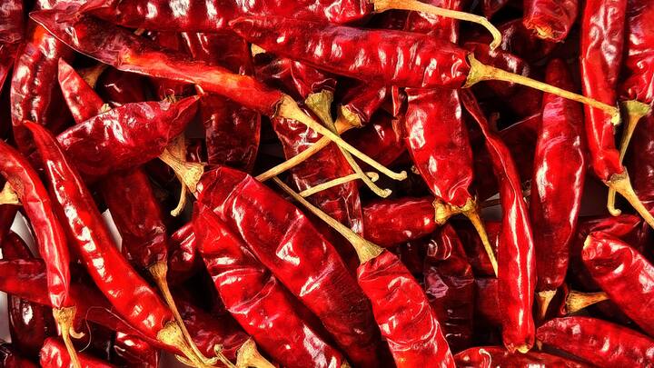 3. Dried Red Chilli: Dried red chilies are essential in South Indian cuisine. They add a rich and smoky flavour to the dishes. They're often used in tempering, sambar, and chutneys for an added flavour. (Image Source: Canva)