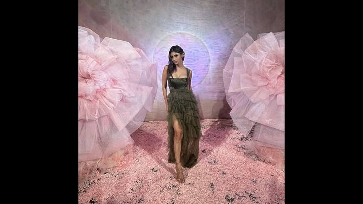 3. Mouni Roy: Mouni Roy looks dazzling in an olive green gown with a structured bodice with cascading ruffles. Her outfit combines elegance and charm to create a perfect chic evening look. (Image Source: Instagram/@imouniroy)