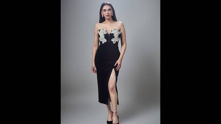 4. Aditi Rao Hydari: Aditi Rao Hydari stuns in a strapless black gown with white floral appliques. The gorgeous black outfit exudes timeless sophistication and minimalism for an elegant evening gatherings. (Image Source: Instagram/@aditiraohydari)