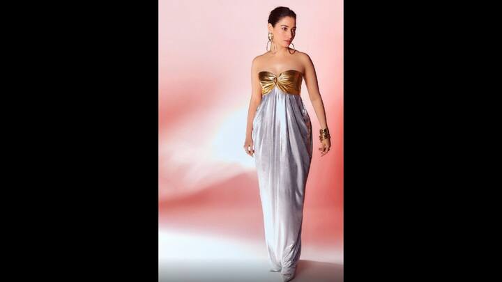 6. Tamannaah Bhatia: Tamannaah Bhatia stuns in a metallic gown with a dual tone twist. The golden bustier and silver draped silhouette blend boldness with grace, creating an effortlessly elegant. (Image Source: Twitter/@filmfare)