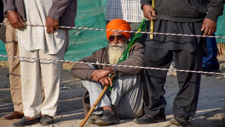 A farmer at the protest site at Shambhu Border before the start of their march towards Delhi, in Patiala district. (Photo: PTI)