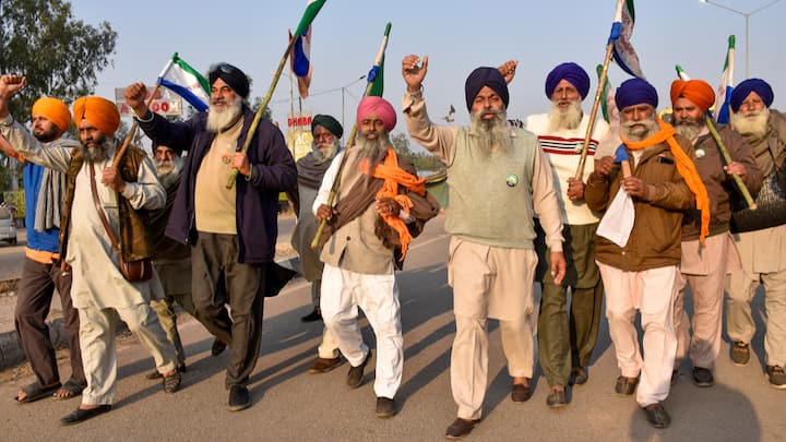 Farmers raise slogans as they gather at the protest site at Shambhu Border before the start of their march towards Delhi, in Patiala district. (Photo: PTI)