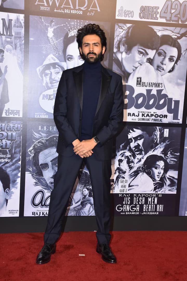 Kartik Aaryan turned heads in a royal blue pantsuit, sporting a rugged yet dashing look.