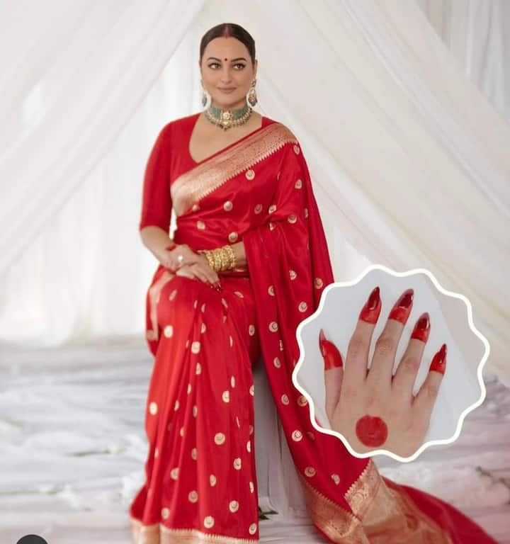 Sonakshi Sinha's Bridal Look: Sonakshi Sinha kept her bridal look very minimal, instead of heavy lehenga, she wore a red colored Banarasi saree, which had golden colored zari work, with it she paired emerald jewellery.