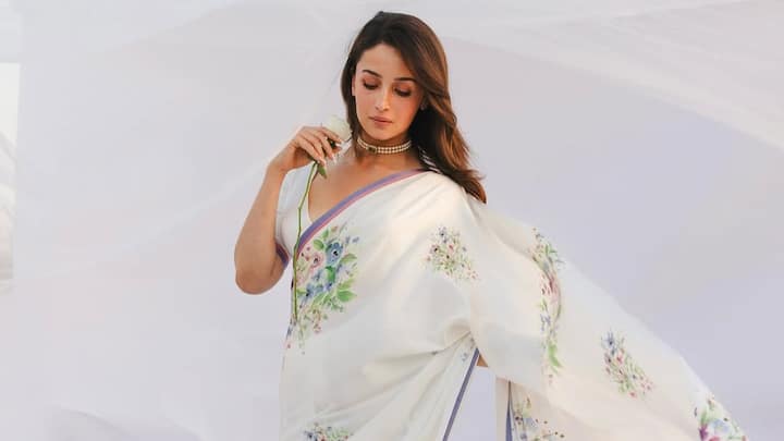 Alia Bhatt attended the centenary celebrations of late Indian cinema legend Raj Kapoor in Mumbai, looking ethereal in a white saree adorned with pastel floral prints.