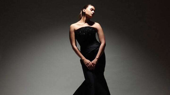 She  now has a sleek silhouette in an elegant black mermaid gown at the Filmfare 2024. The strapless number basically highlighted her graceful silhouette, while the flamboyant flare at the hem added a sophisticated glamorous touch to her on red carpet attendance.  (Image source: Instagram/ aliaabhatt)