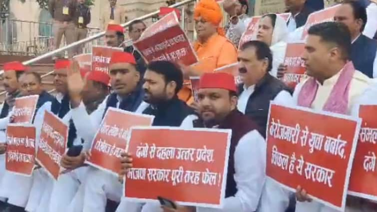 UP Assembly Winter Session SP Leaders Stage Protest Over Sambhal Paper Leak Issue