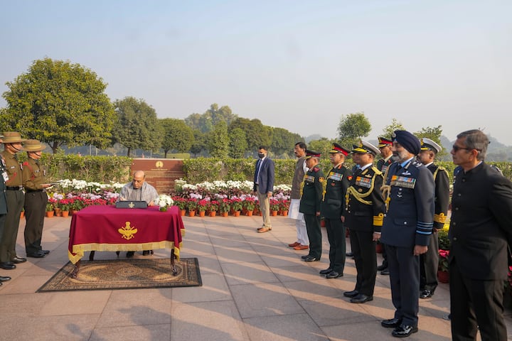 Union Defence Minister Rajnath Singh signs visitor's register at the National War Memorial on the occasion of the Vijay Diwas, marking India's victory in the 1971 Bangladesh liberation war, in New Delhi, Monday, Dec. 16, 2024. (Source: PTI)