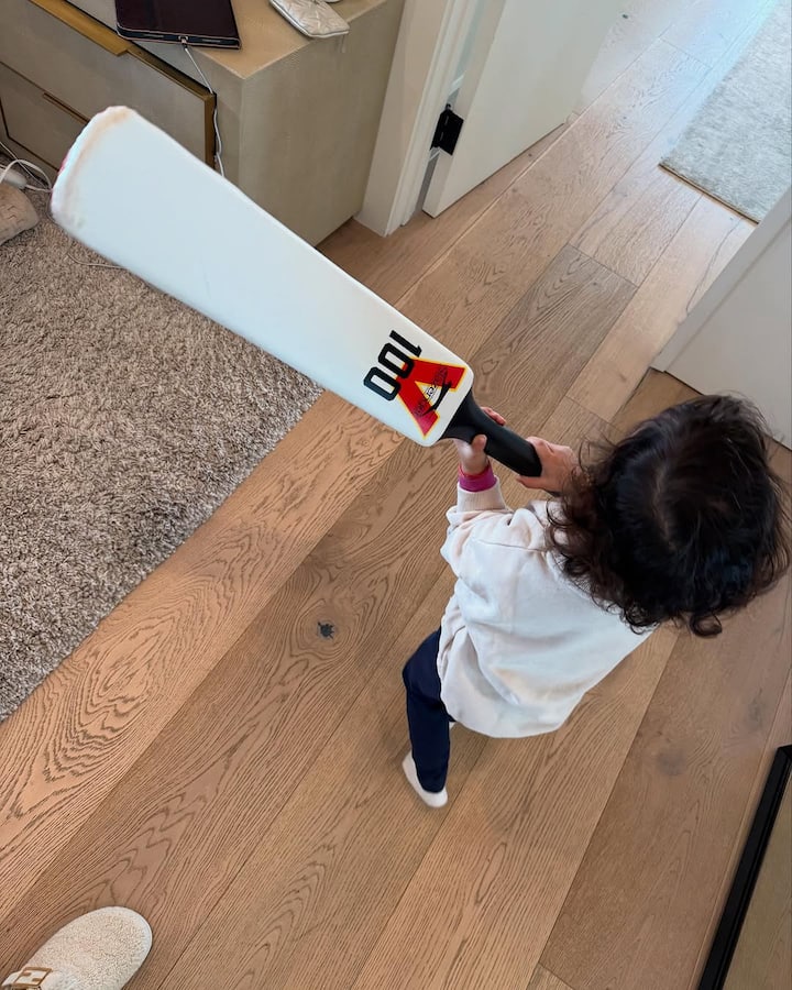 In one photo, Malti was seen playing with a cricket bat, dressed in a white sweater and black pants.