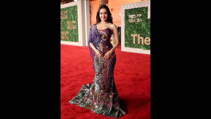 2. Shraddha Kapoor: Shraddha Kapoor looked mesmerising in a vibrant and multicoloured sequined gown. The bold hues and intricate patterns of her outfit gave her a contemporary elegance. (Image Source: Twitter/@yourfavnook)