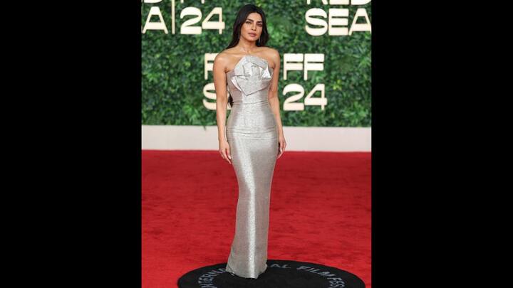6. Priyanka Chopra: Priyanka dazzled in a metallic strapless gown that radiated elegance and modernity. The fitted outfit with intricate detailing highlighted her stunning style on the red carpet, blending sophistication with a touch of glamour effortlessly. (Image Source: Twitter/@Fashion_Critic_)