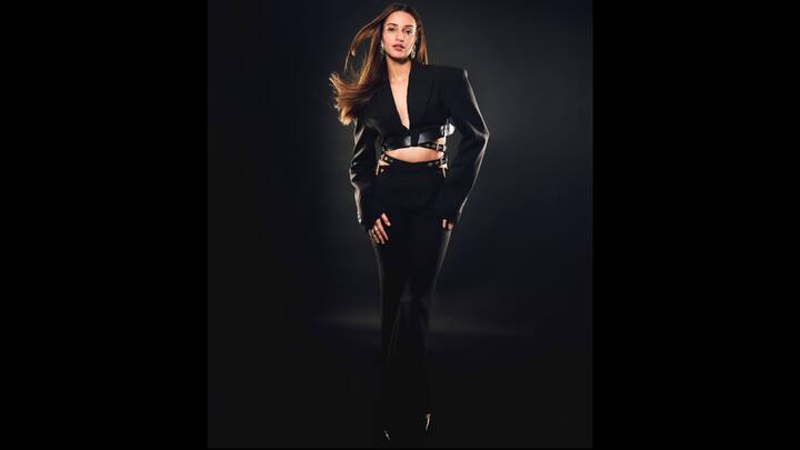 8. Tripti Dimri: Tripti Dimri's edgy black suit with bold cut outs is an ideal option for New Year's Party. Its structured yet daring design gives a contemporary look which showcases the actress's confidence. (Image Source: Instagram/@tripti_dimri)