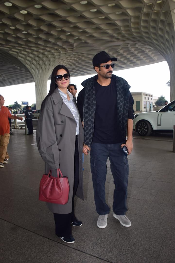 Completing her look, she carried a vibrant pink handbag, which added a pop of colour to her ensemble.