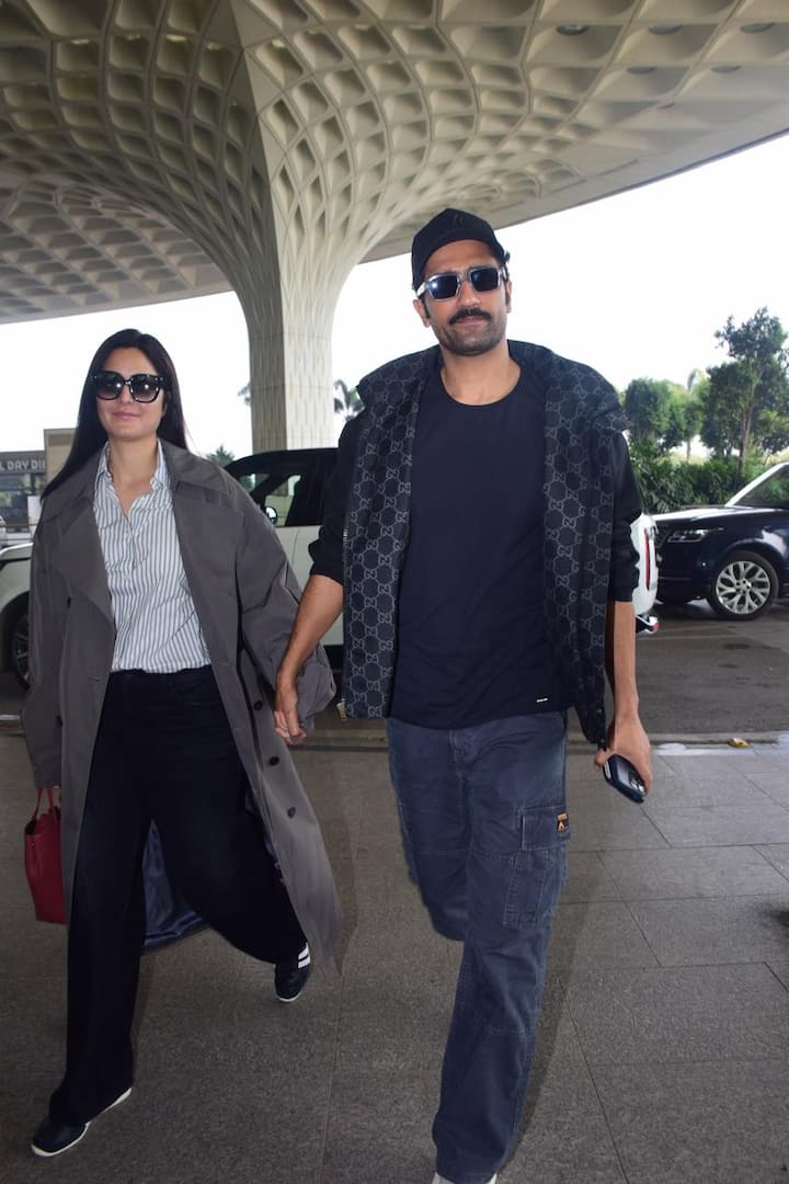 She added a cozy gray overcoat to her outfit and styled her hair in a simple center partition.