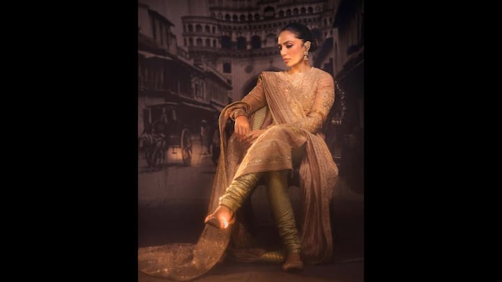 1. Sobhita Dhulipala: Sobhita Dhulipala has worn a golden and champagne toned outfit that blends elegance with sophistication. Her outfit has a beautifully embroidered silhouette which gives her a classy look. The actress's outfit is ideal for New Year celebrations. (Image Source: Instagram/@sobhitad)
