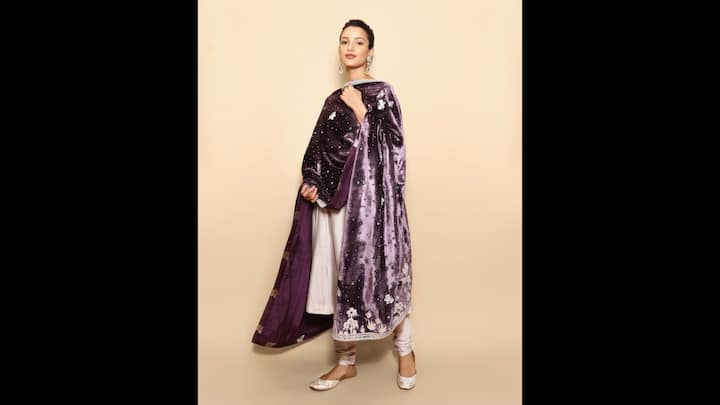 4. Tripti Dimri: Tripti's outfit with velvet dupatta and an understated anarkali embodies a vintage charm. The outfit, perfect for the New Year parties, gives the actress a regal look. The glamorous outfit is ideal for evening gatherings with family or friends. (Image Source: Instagram/@tripti_dimri)