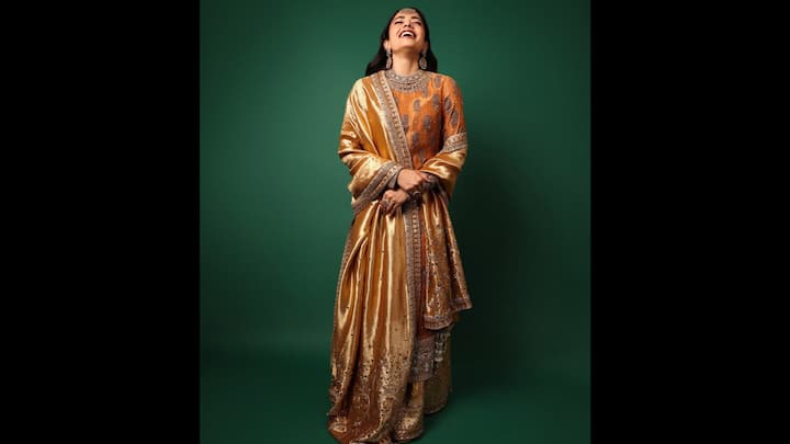 6. Rashmika Mandanna: Rashmika Mandanna's golden suit radiates regal charm. The outfit has been intricately embroidered which makes it perfect to set a luxurious vibe. The rich velvet and gleaming details are ideal for embracing the New Year celebrations. (Image Source: Instagram/@rashmika_mandanna)