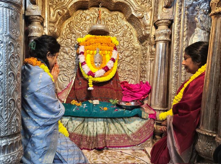 Dressed in a blue salwar suit with a matching dupatta, she adorned marigold garlands and a tilak on her forehead.