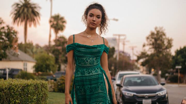 Maxi dresses with unique necklines: Consider flowy maxi dresses featuring halter-neck or off-shoulder neck styles. It's a dress that gives one a chic and relaxed style for ushering in the New Year while staying comfortable at the same time. (Image Source: Canva)
