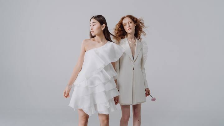 White Cut Out Dress: This flawless white georgette dress is accentuated with bell sleeves and cut-out details that give your outfit sass. Pair it with statement hoops for an effortlessly polished look that's sure to turn heads. (Image Source: Canva)