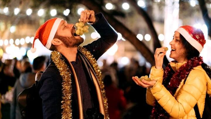 3. Eating 12 Grapes: In Spain, grapes are believed to be lucky. Eating 12 grapes, one with each midnight chime, is a cherished tradition that brings luck, happiness, and prosperity for the coming year. (Image Source: Pinterest/notjustatourist)