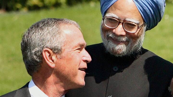 Prime Minister Manmohan Singh and US President George W. Bush share a light moment while posing for a photo at the G-8 Summit in Heiligendamm, Germany on Dec. 31, 2007.