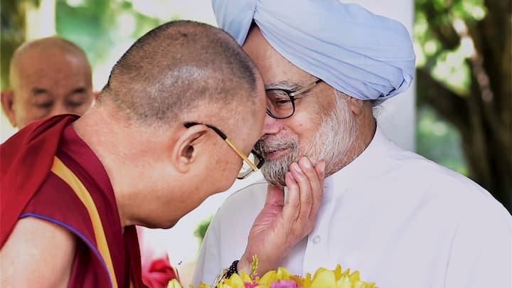 Tibetan Spiritual leader, Dalai Lama gestures during a meeting with former Prime Minister Manmohan Singh in New Delhi on Sept. 22, 2014.