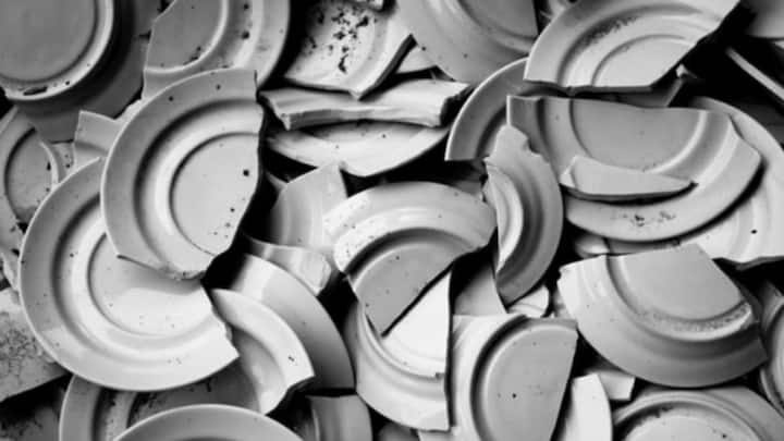 4. Smashing Plates: In Denmark, a unique New Year tradition involves breaking dishware on the doorsteps of family and friends. It's believed that the more shards are outside your home, the luckier you will be. (Image Source: Pinterest/rachelbice6)