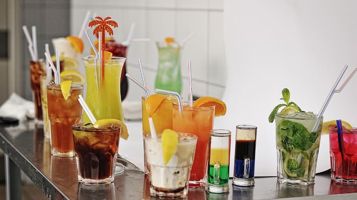 5. Mocktail Station: You can set up a mocktail station at your home. Create a variety of mocktails with your friends and experiment with the flavours. It's a perfect way to enjoy delicious drinks while adding a unique and interactive element to your celebration. For a fun and refreshing New Year's Eve celebration, this activity is perfect and enhances the party's atmosphere. (Image Source: Canva)