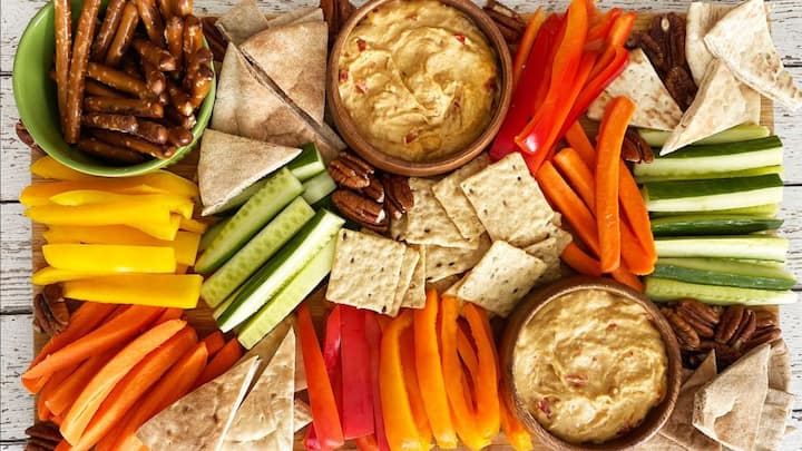 7. Snack Board: Before the party, everyone can choose a theme and bring a snack board related to their theme. This adds more varieties, meals, and flavours to the party ensuring there's something for everyone. These themed snack boards bring a creative touch to your New Year's Eve celebration making them fun for all. (Image Source: Pinterest/healthyfamilyproject)