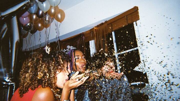 1. Host A House Party: You can host a fun and intimate house party with your family and friends. It's a great way to celebrate New Year's Eve with your loved ones. A house party gives you an opportunity to spend quality time with your close ones and create unforgettable memories. (Image Source: Pinterest/byrawpixel)