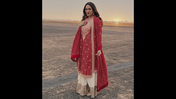 6. Sonakshi Sinha: Sonakshi Sinha stuns in a vibrant red suit paired with white sharara, making it a perfect choice to ring in the New Year with elegance. The actress has complemented her look with stunning pearl earrings that makes her look even more graceful. (Image Source: Instagram/@aslisona)