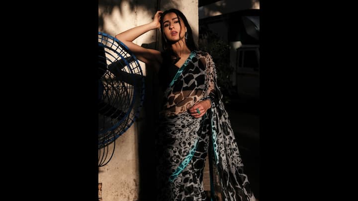 3. Sara Ali Khan: Sara Ali Khan's leopard print saree with teal accents merges boldness with tradition. Tis modern styled drape shows elegance as well as boldness. The actress's look is perfect to enter the New Year with style and ethnicity. (Image Source: Instagram/@saraalikhan95)