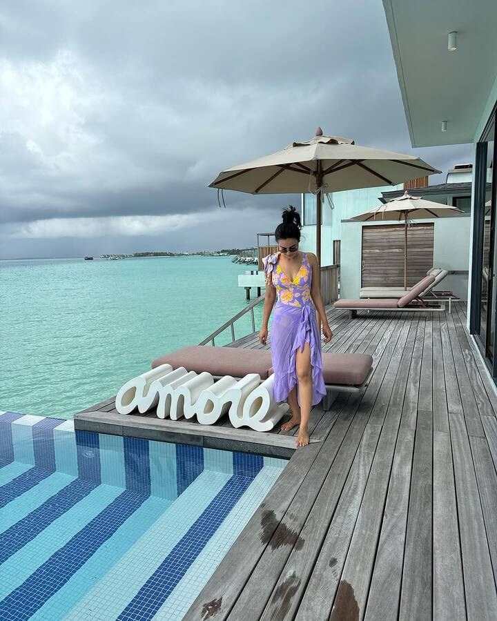 Surbhi paired her purple monokini with a sheer purple skirt that added an elegant touch.