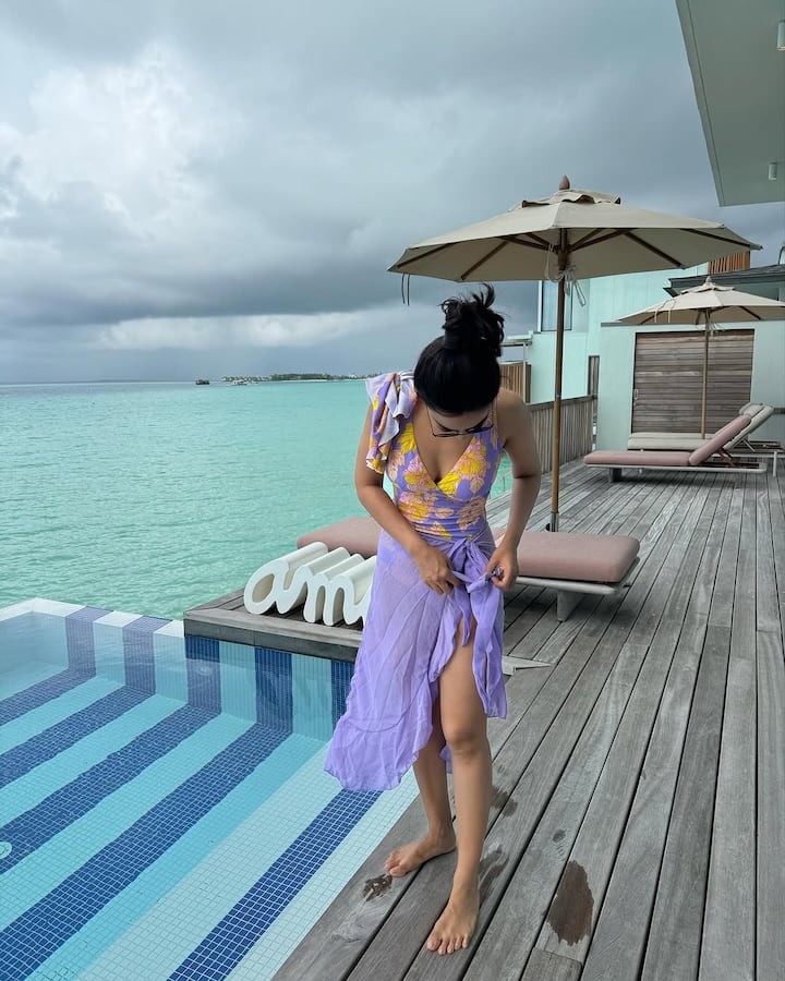 Surbhi shared breathtaking photos in a floral beachwear.