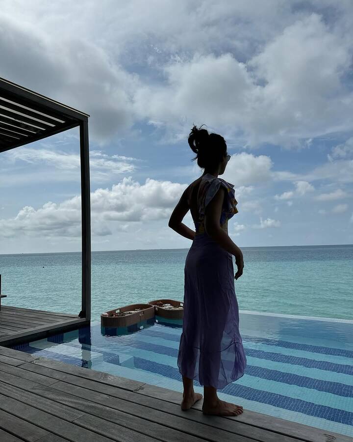 Surbhi struck a pose by the pool and wrote a caption, 