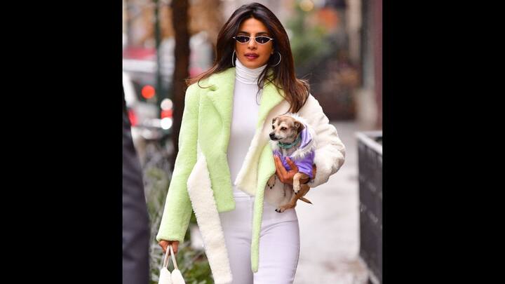 4. Priyanka Chopra: Priyanka Chopra has nailed her winter look with a chic dual shade teddy jacket in white and mint colours. To keep herself warm, the actress has worn a white turtleneck top. She has completed her look with bold sunglasses and big silver hoops. (Image Source: Twitter/@filmfare)