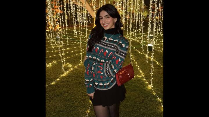 8. Khushi Kapoor: Khushi Kapoor stuns in her chic winter look, wearing a black turtleneck top paired with a green sweater and a black mini skirt. The actress has also worn black sheer stockings to keep herself cosy. Her outfit is ideal for winter season as it beautifully blends fashion with comfort. She has accessorised her look with a striking red bag and a delicate necklace. (Image Source: Instagram/@khushikapoor)
