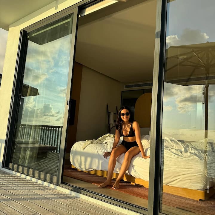 From basking under the golden sun to enjoying the tranquil blue waters, every frame exudes her love for travel, nature, and style.